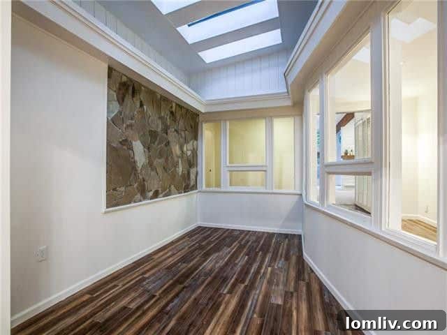 Before staging of a long, sectioned-off room