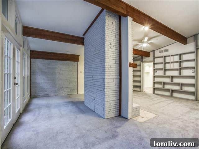 Before staging, room with dated carpet