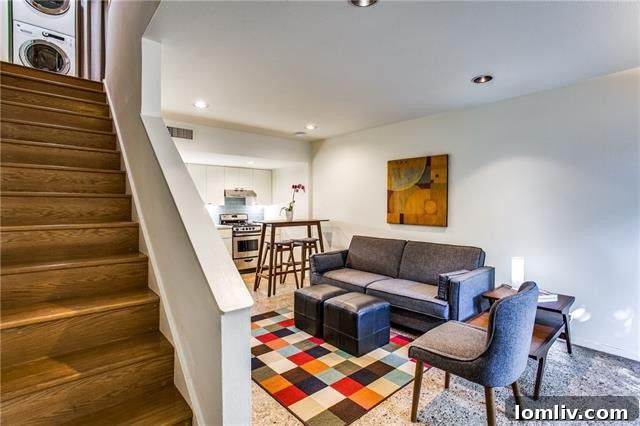 Interior shot showing Terrazzo floors and updated kitchen in a Bud Oglesby condo
