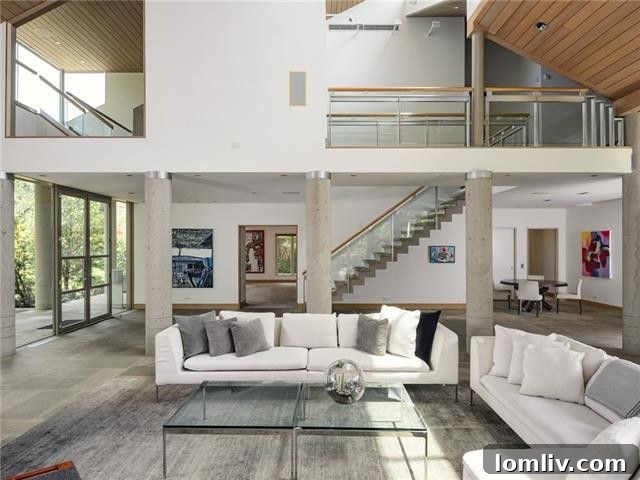 Interior of 3709 Lexington Ave, showcasing a soaring great room with glass walls
