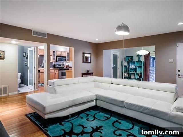 Interior living area of a Mahanna Street condo with bamboo floors and pool view