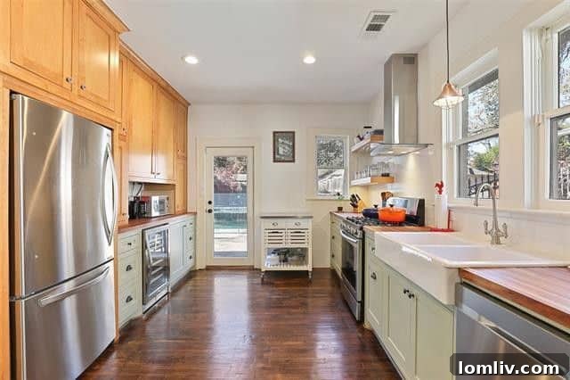 Kessler Park's Holiday Surprise: The Splurge Versus The Smart Steal 5 Modern gourmet kitchen with a wine fridge in a Kessler Park Tudor house