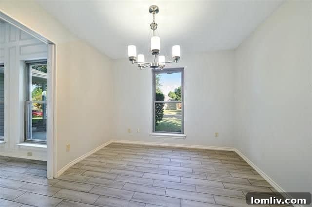 Elegant dining room with ceramic tile flooring in a Plano house