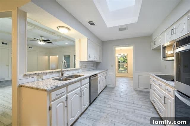 Modern kitchen with granite countertops and double oven in Plano