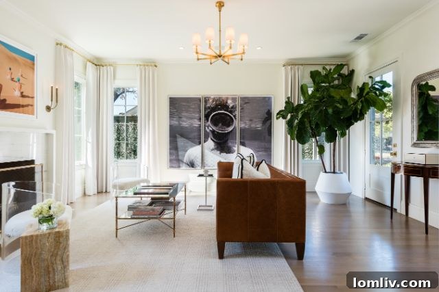 Bright and airy foyer of the Bluffview Estates luxury home, showcasing high ceilings, pristine white walls, and a flood of natural light through French doors.