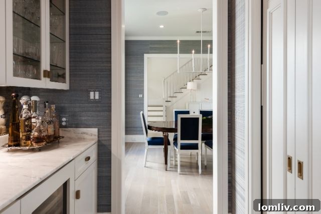 Sophisticated open-concept living room featuring a stunning marble fireplace, abundant natural light, and ample space for elegant entertaining in Dallas.