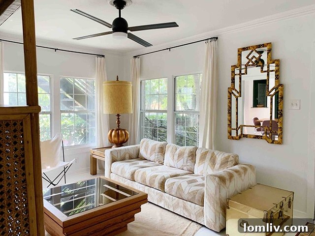 Interior view of Jessica Jamison's unique Airbnb listing, showcasing a curated collection of vintage furniture ranging from elegant mid-century modern pieces to glamorous late 70s finds. Each item is thoughtfully chosen to create a cohesive and inviting guest experience, embodying the spirit of Wrecking Ball Collective's diverse aesthetic.