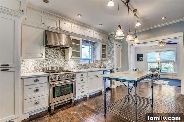 Modern kitchen with marble countertops in a historic bungalow