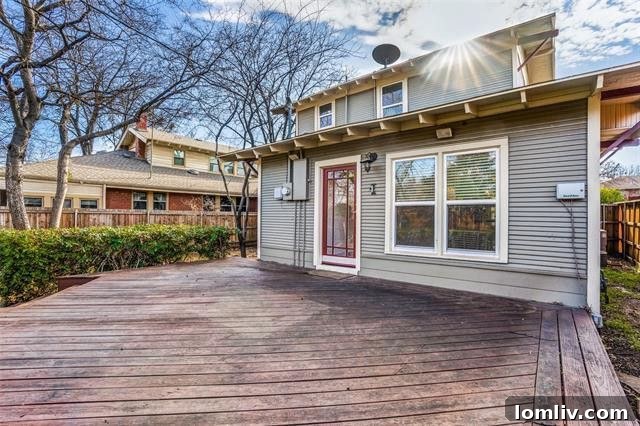 Spacious wooden deck for outdoor entertaining with mature trees