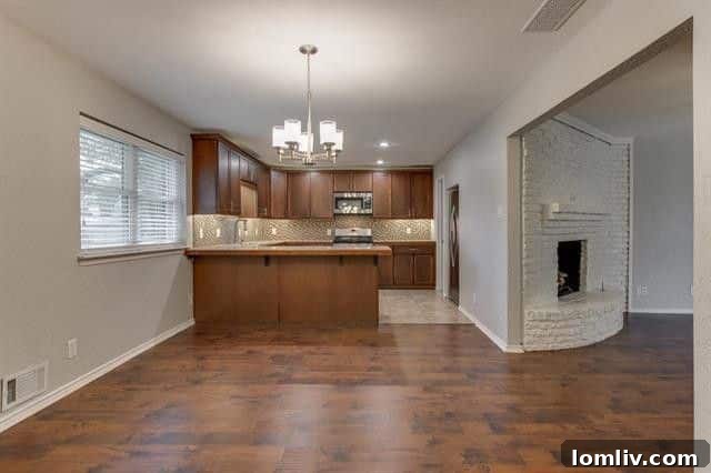 Generous living room with ample natural light at 9444 Springwater Drive