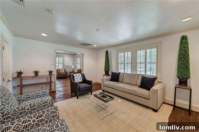Spacious formal living room interior at 1200 Clover Lane, highlighting hardwood floors and natural light.