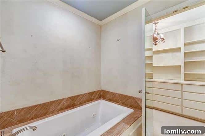 Luxurious en-suite master bathroom at 1200 Clover Lane, featuring modern fixtures and elegant finishes.