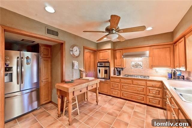 Spacious interiors of 9730 Forestridge Drive, featuring original wood flooring and bright living spaces.