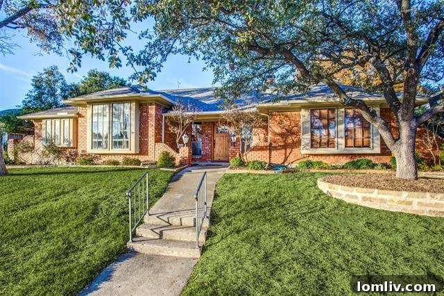 Stunning red brick exterior of 9447 Viewside Drive in Lake Highlands, offering exceptional curb appeal.