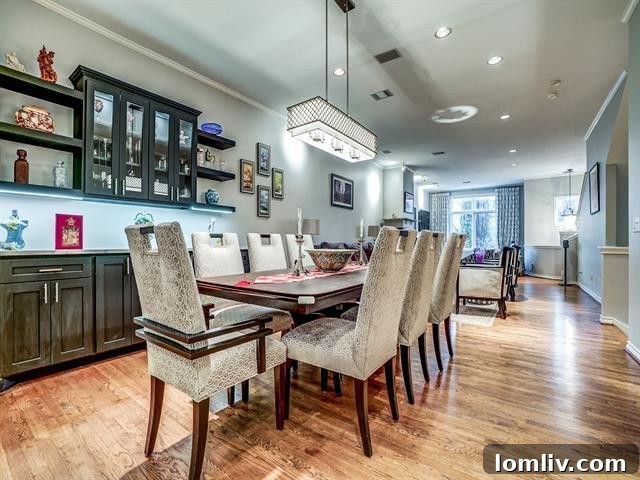 Stylish dining area with designer lighting in Uptown Dallas townhome