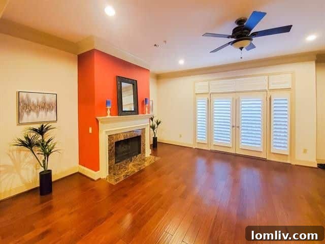 Inviting living space with wood floors and high ceilings in Dallas condo