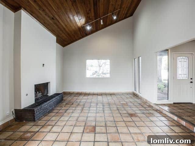 Spacious living room with hardwood floors and ample natural light