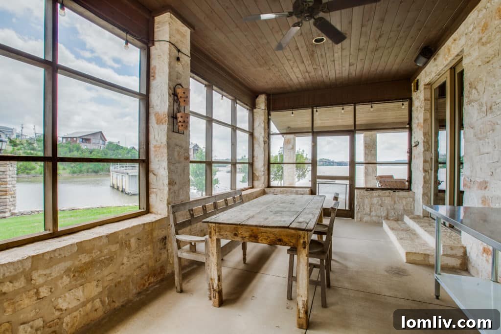 Interior Living Room with Stone Fireplace and Lake Views
