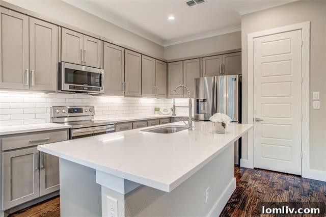 Gourmet kitchen with Calacatta white quartz countertops and custom cabinetry