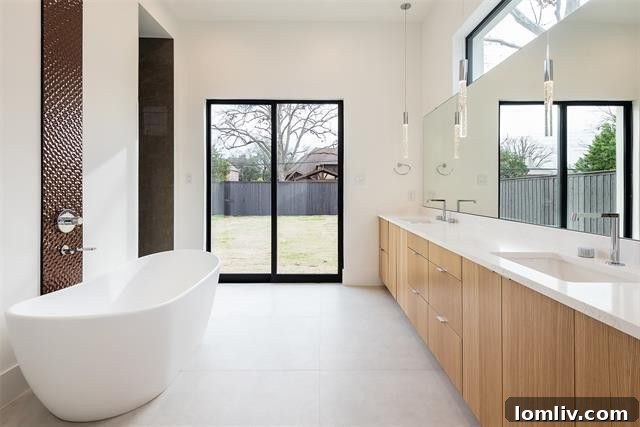 Luxurious gourmet kitchen with Subzero and Wolf appliances and a grand waterfall island
