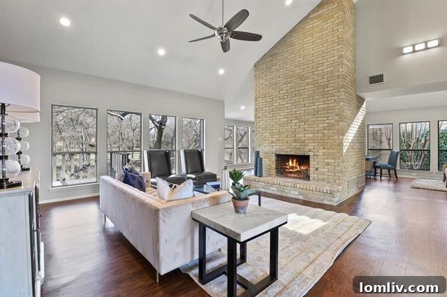 Spacious Living Room with Floor-to-Ceiling Brick Fireplace