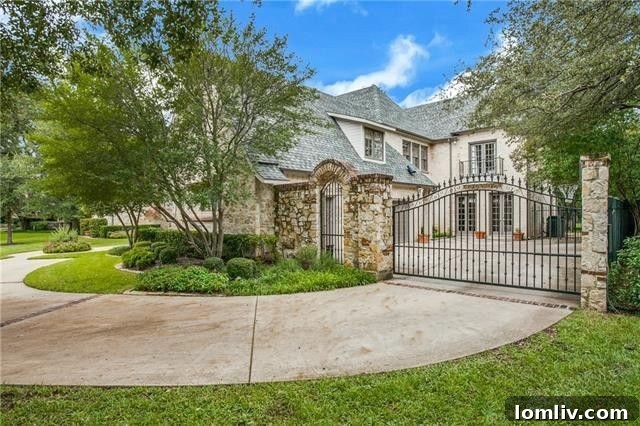 Front exterior of a stately traditional home on Woodfin Drive in Old Preston Hollow, Dallas.