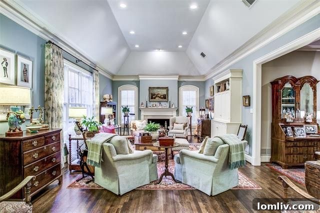 Bright and spacious living room with built-in shelving and abundant natural light.