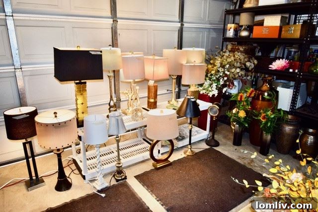 A curated display of sophisticated home accessories, including lamps, artwork, and decorative objects.