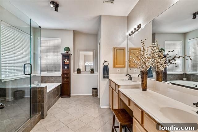 Elegant kitchen with a large island and ample cabinetry, opening to the living area at 7112 Vista Hill Lane.