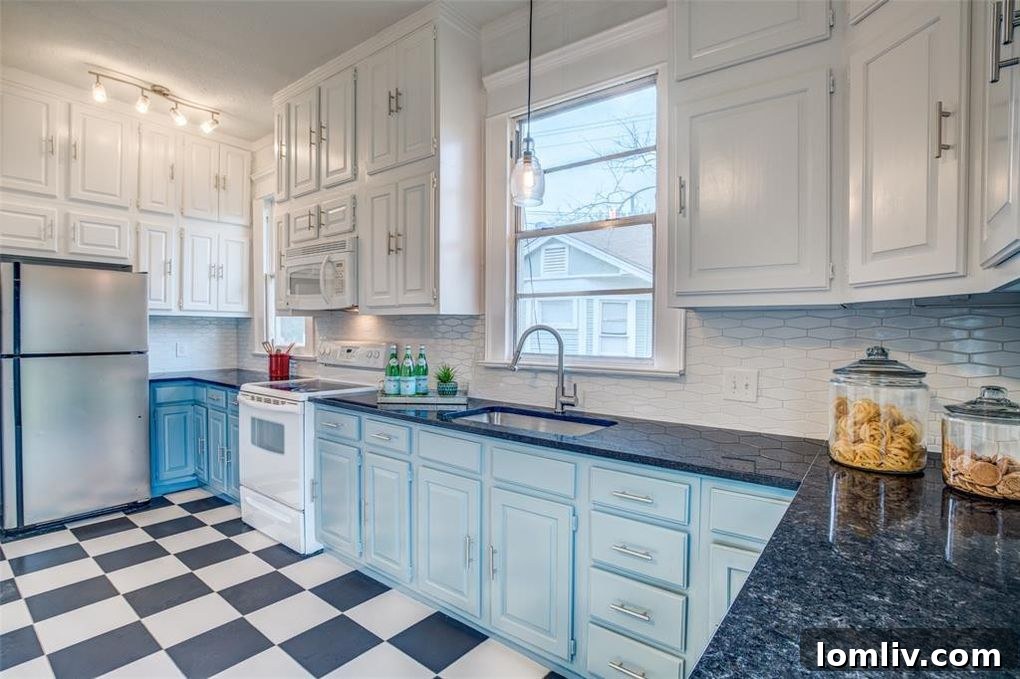 5605 Worth St exterior, featuring a charming covered front porch and vibrant blue details.