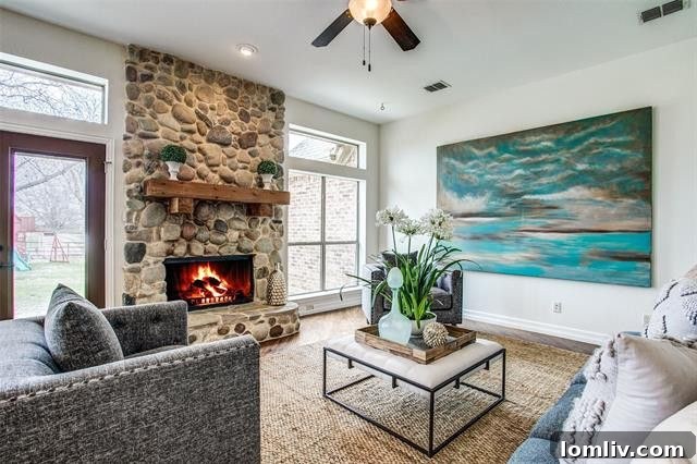 Spacious open concept living and dining area with gleaming hardwood floors, creating an inviting flow for entertaining.