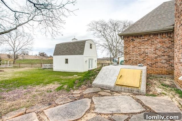 Charming exterior view of the updated Boyd country home, featuring a welcoming front porch and well-maintained landscaping.
