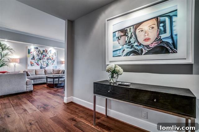 Living area with custom art lighting and walnut floors in Unit 1202