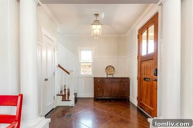 Elegant front entrance with a dark wood door and intricate detailing