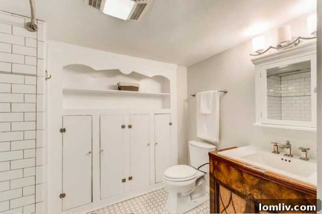 Bright white bathroom with ornamental wooden cabinets