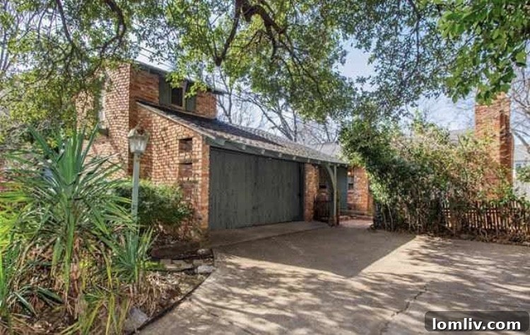 Charming facade of the Charles Dilbeck-inspired cottage at 3609 McMillan Ave in East Dallas