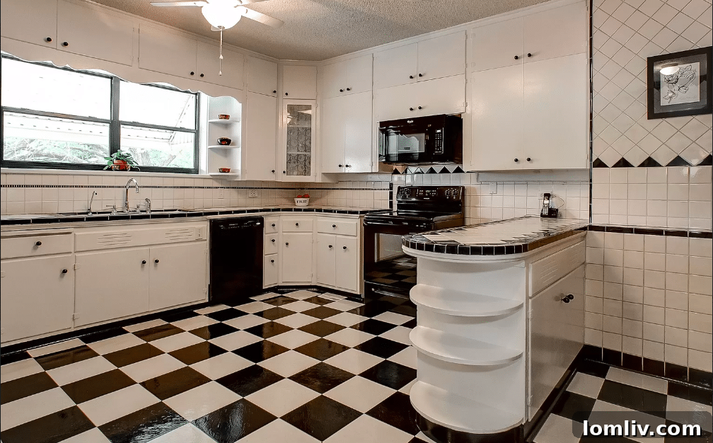 Historic Tate Home Near Downtown Weatherford: Under $1 Million Opportunity 8 Charming bedroom with distinctive patterned wallpaper in Tate Home