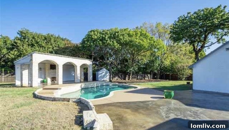 Lush Landscaping Surrounding the Pool in a Southlake Home
