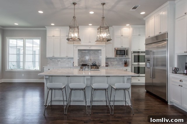 Elegant 3/4″ tongue-in-groove hardwoods flow through the common areas of this luxurious Colonial Revival home.