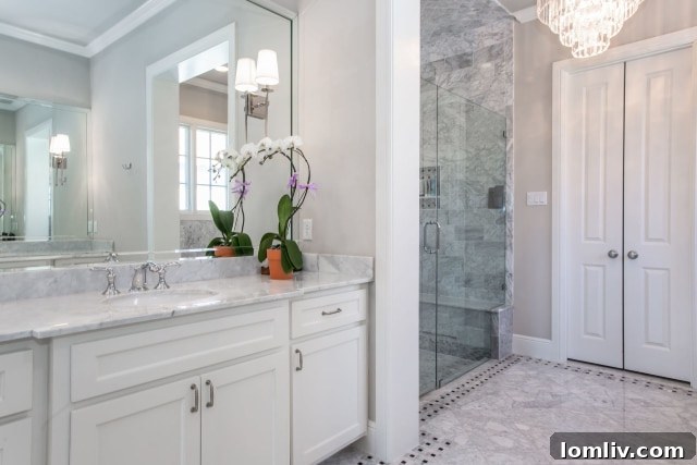 The luxurious master bathroom of 9409 Marbella Drive, featuring elegant fixtures and finishes.