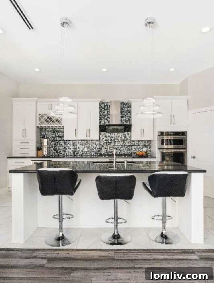 Experience Greenway Parks Luxury Now: Flexible Leasing, No Million-Dollar Commitment 5 Gourmet chef's kitchen with high-end appliances and breakfast bar in luxury Dallas rental