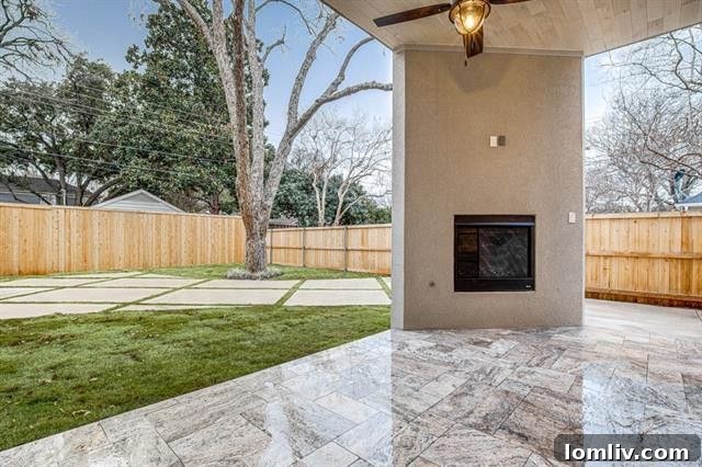 Peaceful Backyard with Covered Patio and Fireplace