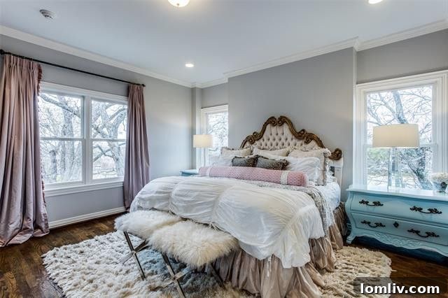 Spacious bedroom with natural light and elegant furnishings