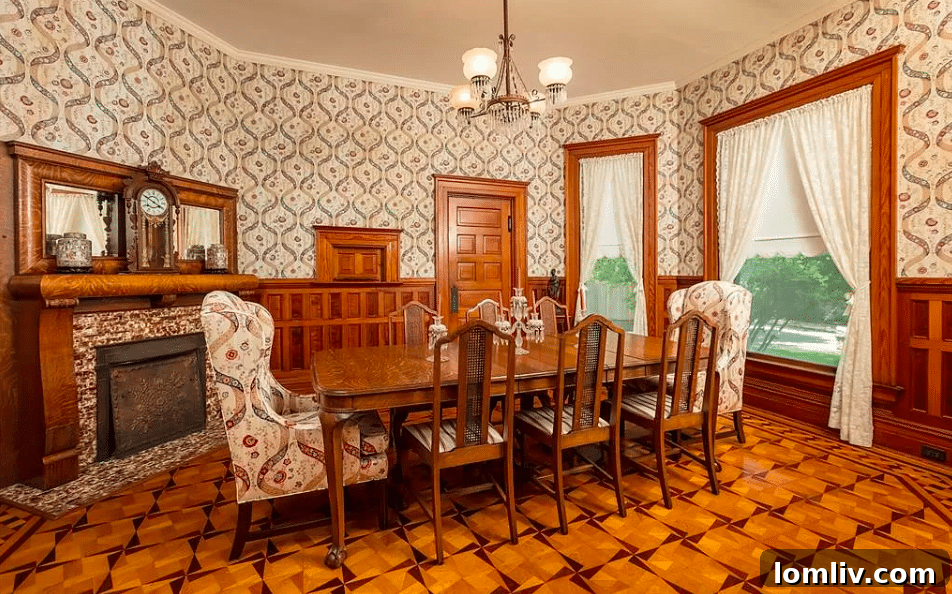 Interior view of the Baker Home, showcasing elegant parquet flooring and a historic fireplace