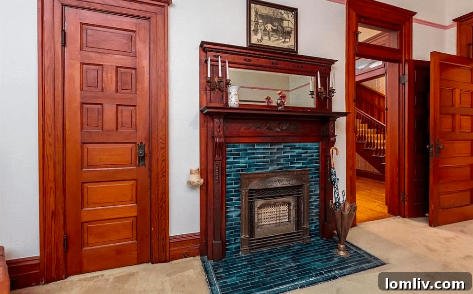 Grand wooden staircase with intricate detailing in the Baker Victorian mansion