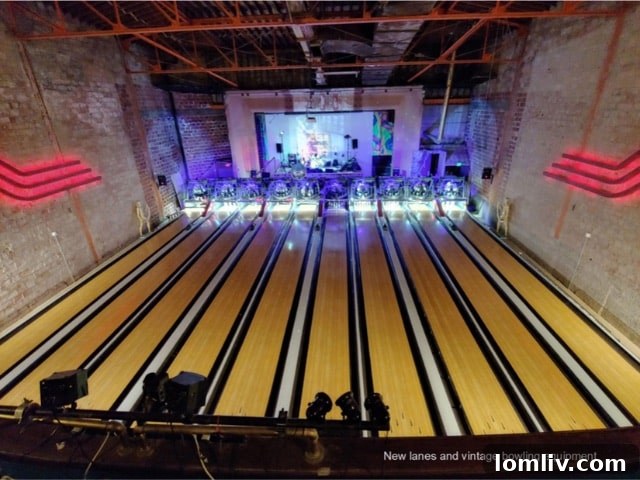 Upstairs area of Bowlski's Lakewood Theater, with pool tables and seating overlooking the main floor