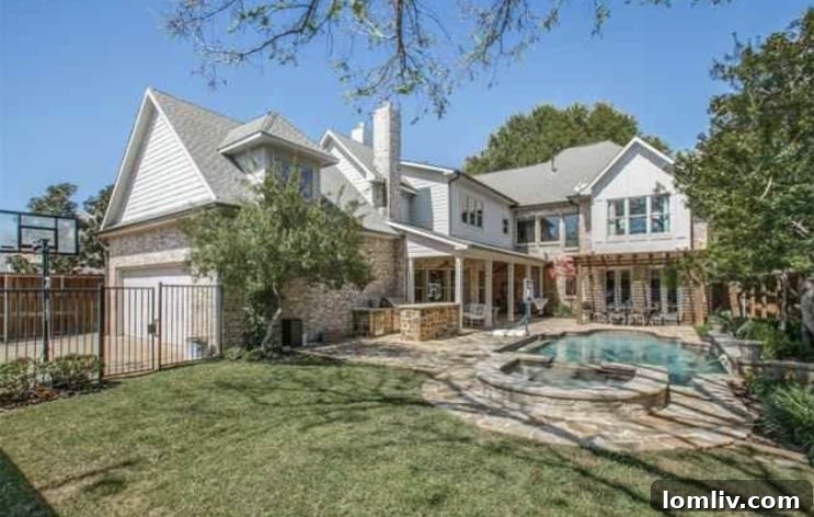 Wide Shot of the Luxury Home's Backyard, Pool, and Exterior Architecture