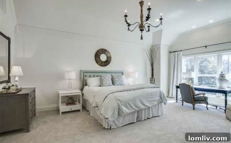 Elegant Master Bedroom with Vaulted Ceilings, Bay Window, and Cozy Sitting Area
