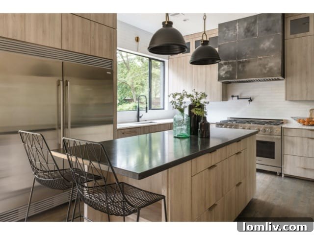 Forest Hills Modern Ranch Reimagined 11 State-of-the-art kitchen featuring a large central island, professional-grade appliances, and ample cabinetry