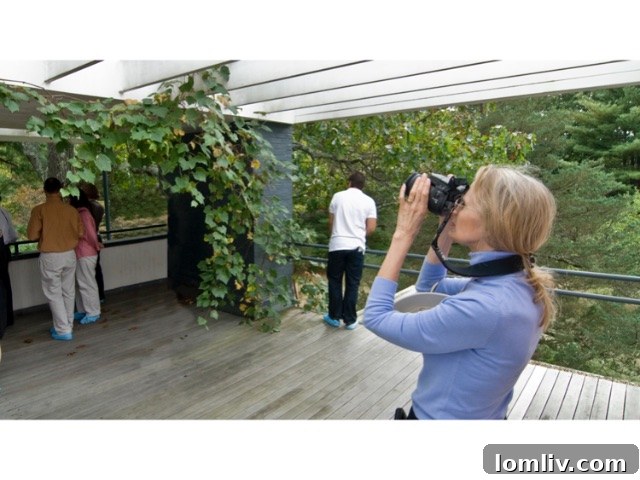Virginia Savage McAlester: Guardian of Heritage, Chronicler, and Advocate for Change 12 Virginia Savage McAlester actively photographing architectural details during a New England research tour